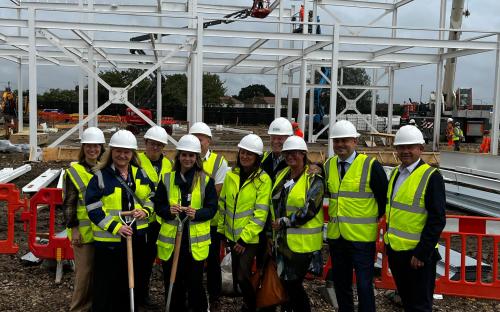 Councillor Richard Bingley and others with spades at a building site 