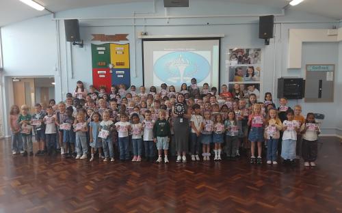 Pupils at Kenningtons Primary with Shield