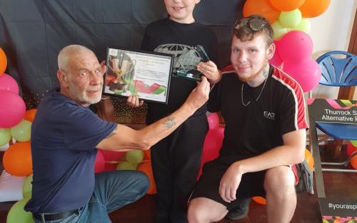 (Middle) One of the SEND and Alternative Provision Award winners, Zach, with his family