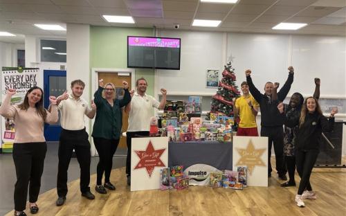 Cllr Vikki Hartstean (third from left) with staff and gift donations from Impulse Leisure Centre last year (December 2024) as part of Give a Gift 2024