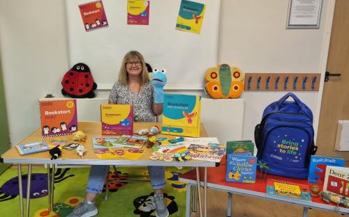 One of the Family Hub facilitators, with some of the Bookstart activities families can expect to enjoy at East Tilbury Library